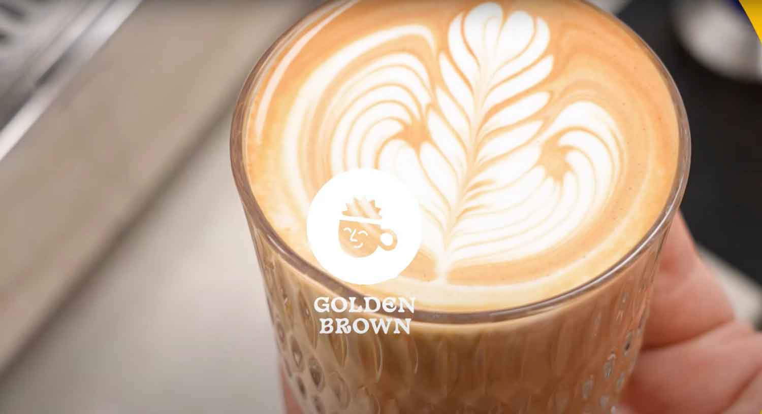 golden brown logo on latte