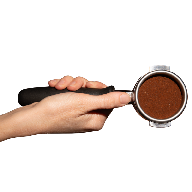 hand holding portafilter with coffee