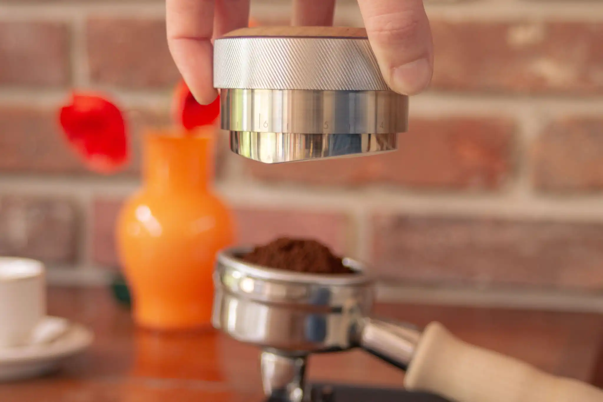 tamping coffee in portafilter